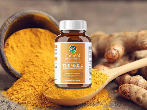 Ancient Healthcare Turmeric Curcumin & Bioperine capsule bottle with turmeric powder and fresh roots